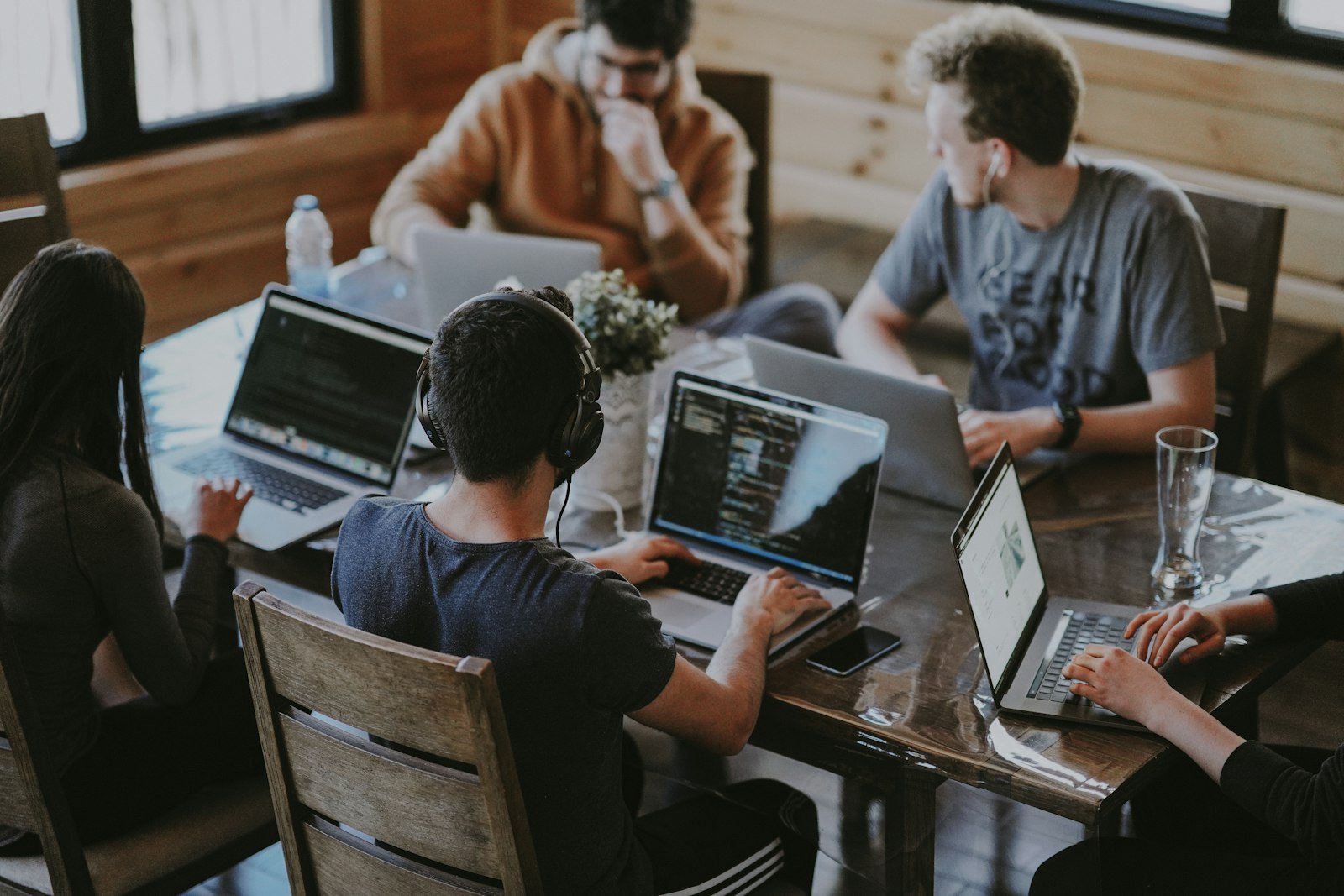 A collaborative technology team working around a table