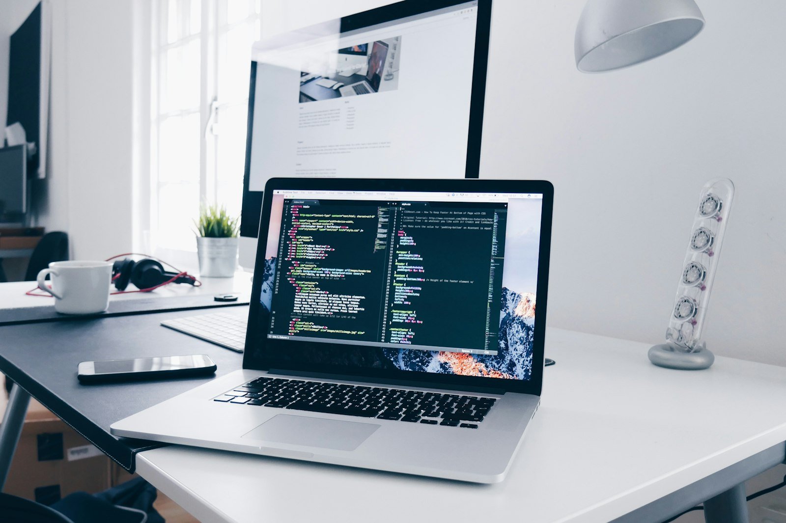 Code editor on a monitor in a professional development workspace